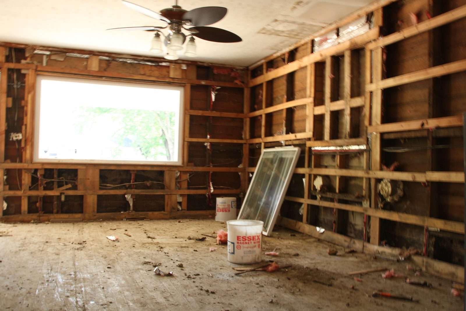Kitchen stripped to the studs after a flood, with the framing drying